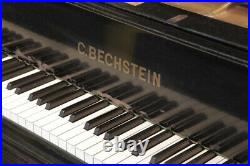 A 1900, Bechstein model E grand piano with a polished, black case and spade legs