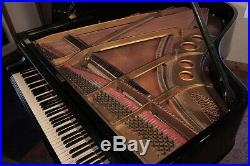 A 1902, Steinway Model O grand piano with a black case and spade legs