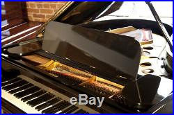 A 1909, Steinway Model O grand piano with a black case and spade legs