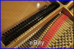 A 1952, Steinway Model O grand piano with a black case. 12 month warranty