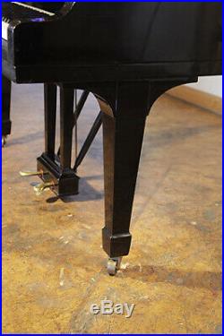 A 1952, Steinway Model O grand piano with a black case. 12 month warranty