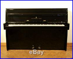 A 1961, Steinway Model F upright piano with a black case. 3 year warranty