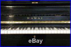 A 1968, Kawai KU-3 upright piano with a black case