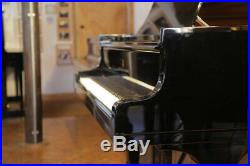 A 1974, Steinway Model B grand piano with a black case