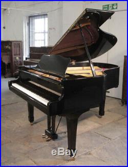 A 1974, Yamaha G2 grand piano with a black case and spade legs. 3 year warranty