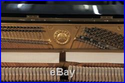 A 1976, Yamaha U1 upright piano with a black case. 3 year warranty