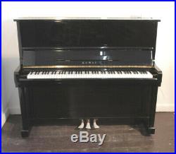 A 1978, Kawai KU-1B upright piano with a black case. 3 year warranty
