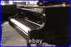 A 1979, Yamaha C7 concert grand piano with a black case. 3 year warranty