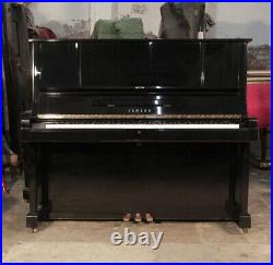 A 1982, Yamaha YUX upright piano with a black case. 3 year warranty