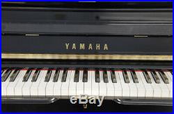 A 1983, Yamaha UX-3 upright piano for sale with a black case and brass fittings