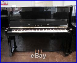A 1985, Kawai NS-10 upright piano with a black case. 3 year warranty