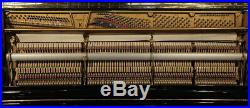 A 1985, Steinway Model K upright piano with a black case. 3 year warranty