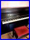 A-1986-Yamaha-LU-101-upright-piano-with-a-black-case-01-hnqi