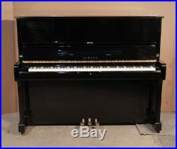 A 1986, Yamaha U1A upright piano with a black case. 3 year warranty