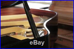 A 1988, Yamaha GH1 baby grand piano with a black case. 3 year warranty