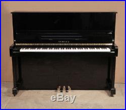 A 1988, Yamaha MC10Bl upright piano with a black case. 3 year warranty