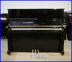 A 1990, Yamaha U1 upright piano with a black case. 3 year warranty