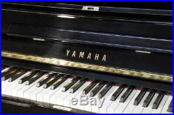 A 1990, Yamaha U1 upright piano with a black case. 3 year warranty