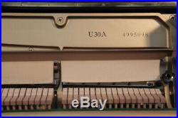 A 1991, Yamaha U30A upright piano with a black case. 3 year warranty