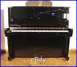 A 1995, Steinway Model K upright piano with a black case. 3 year warranty