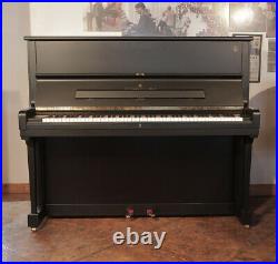 A 1998, Steinway Model V upright piano with a satin, black case. 3 year warranty