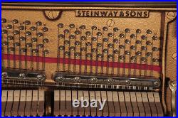A 1998, Steinway Model V upright piano with a satin, black case. 3 year warranty