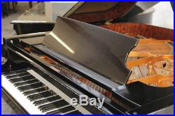 A 2002, Schimmel GP169 Konzert grand piano with a black case. 3 year warranty