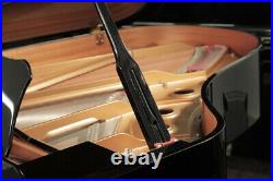 A 2002, Yamaha C3 grand piano with a black case. 3 year warranty