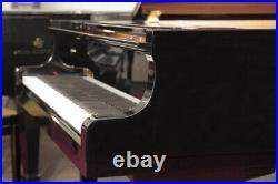 A 2002, Yamaha C3 grand piano with a black case. 3 year warranty