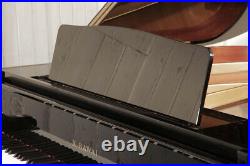A 2003, Kawai GM-10 baby grand piano with a black case. 3 year warranty
