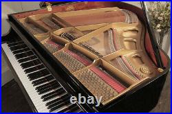 A 2003, Kawai GM-10 baby grand piano with a black case. 3 year warranty