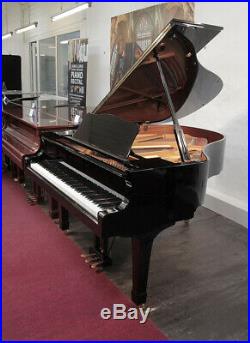 A 2003, Yamaha C2 grand piano with a black case and spade legs