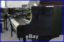 A 2004, Yamaha C3 grand piano for sale with a black case and spade legs