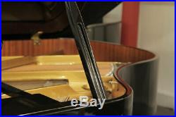A 2011, Hoffmann V158 baby grand piano with a black case. 3 year warranty