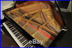 A 2014, Kawai GM-10 baby grand piano with a black case. 3 year warranty