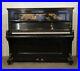 A-Waldemar-upright-piano-with-a-black-case-inlaid-with-doves-in-a-maple-tree-01-wvqy