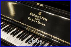 Antique, 1889, Steinway upright piano with a black case. 12 month warranty
