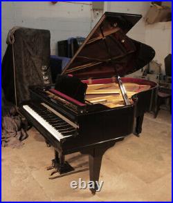 Apollo grand piano with a polished, black case and brass fittings