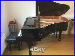 Boston GP178 grand piano with a black case. Designed by Steinway