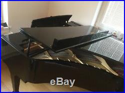 Boston GP178 grand piano with a black case. Designed by Steinway