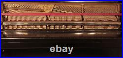 Ibach upright piano with a black case and brass fittings. 2 year warranty