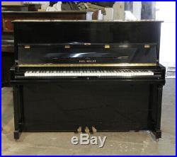 Karl Muller Upright Piano with a Black Case and Brass Fittings
