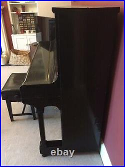 Montague Upright Piano. Black wooden case with metal pin block. Fully working