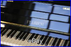 New, Bauhaus style, Feurich Model 115 upright piano with a black case