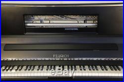 New, Feurich 123 upright piano with a satin, black case & high speed KAMM action
