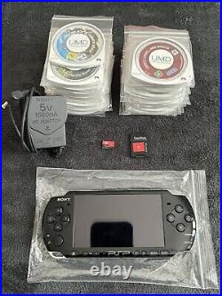 PSP 3003 console with offical Sony charger! 31 UMD Games & 70 Games, Spare Cases