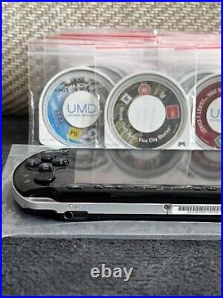 PSP 3003 console with offical Sony charger! 31 UMD Games & 70 Games, Spare Cases