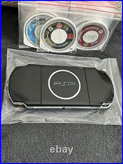 PSP 3003 console with offical Sony charger! 31 UMD Games & 70 Games, Spare Cases