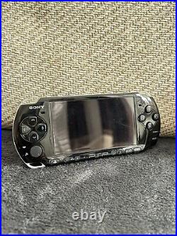 PSP 3003 console with offical Sony charger! 31 UMD Games & 70 Games, Spare Cases