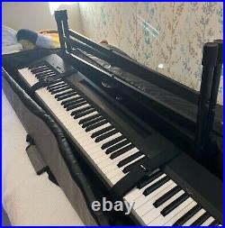 Pre-loved Yamaha P-145 digital piano with foot pedal, stand, books and soft case